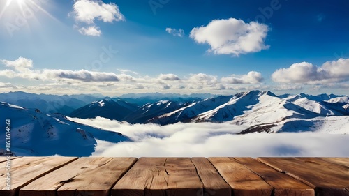 Empty wooden table isolated on snow mountain background with sun light, white clouds. product display concept