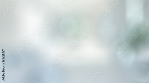 Blurred view of a minimalist apartment interior with white walls, sleek furniture, and minimalist decor elements