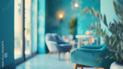 A blurred background of a modern interior with walls painted in a gradient of blue and teal shades