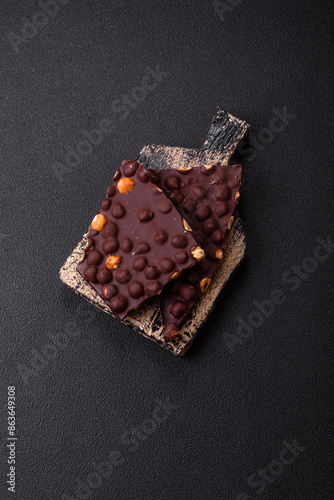 Black bitter chocolate with whole hazelnuts, candied fruits and mint