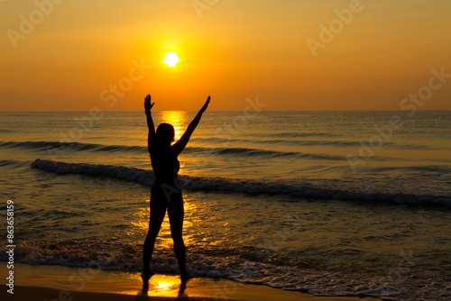 Woman body big with bikini and sunrise on beach