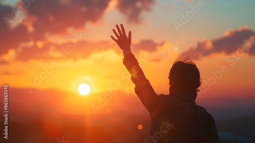 Person Waving Farewell at Sunset with Dramatic Landscape Silhouette