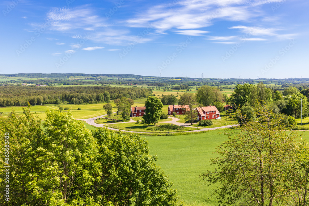 Awesome landscape view with red houses by a road Awesome landscape view with red houses by a road