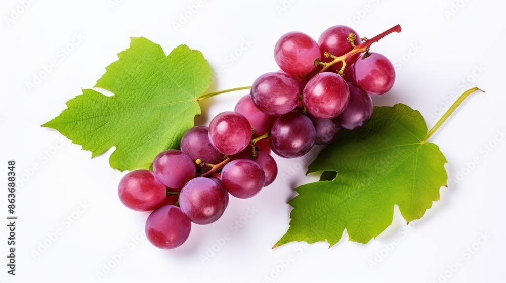 Fototapeta premium Red grapes with green leaves and half sliced on white background. 
