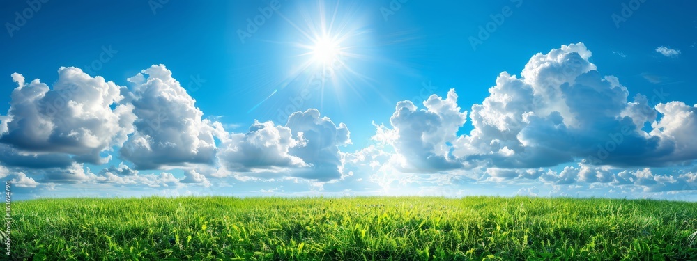 A expanses of green grass lies beneath a vibrant blue sky, with the sun casting its bright light from a peak position midday A expanses of green grass lies beneath a vibrant blue sky, with the sun casting its bright light from a peak position midday