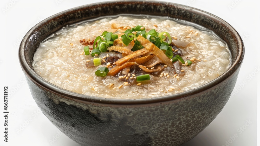 Enticing congee presentation, capturing its smooth consistency and adorned with classic toppings, ideal for food promotion. Enticing congee presentation, capturing its smooth consistency and adorned with classic toppings, ideal for food promotion.