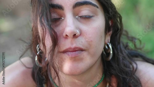 Close-up of young woman showing deep sadness