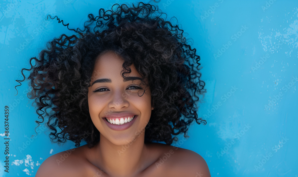 Feeling good in blue. Happy woman with curly hair Feeling good in blue. Happy woman with curly hair