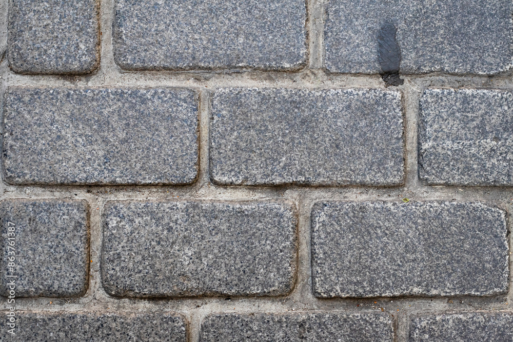 Stone wall texture or background. Gray pavement and cobblestone. Pattern. Top view. Stone wall texture or background. Gray pavement and cobblestone. Pattern. Top view.