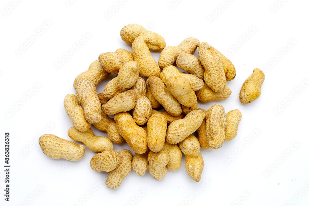 Roasted peanuts in shell on white background. Roasted peanuts in shell on white background.