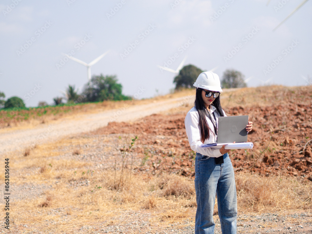 Group of architects working on the basis of a wind turbine Check area structure and wind turbines Group of architects working on the basis of a wind turbine Check area structure and wind turbines