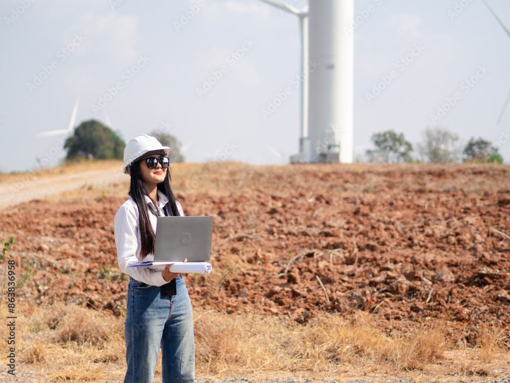 Group of architects working on the basis of a wind turbine Check area structure and wind turbines Group of architects working on the basis of a wind turbine Check area structure and wind turbines