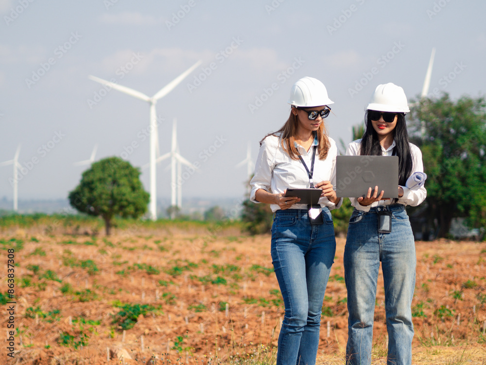 Group of architects working on the basis of a wind turbine Check area structure and wind turbines Group of architects working on the basis of a wind turbine Check area structure and wind turbines
