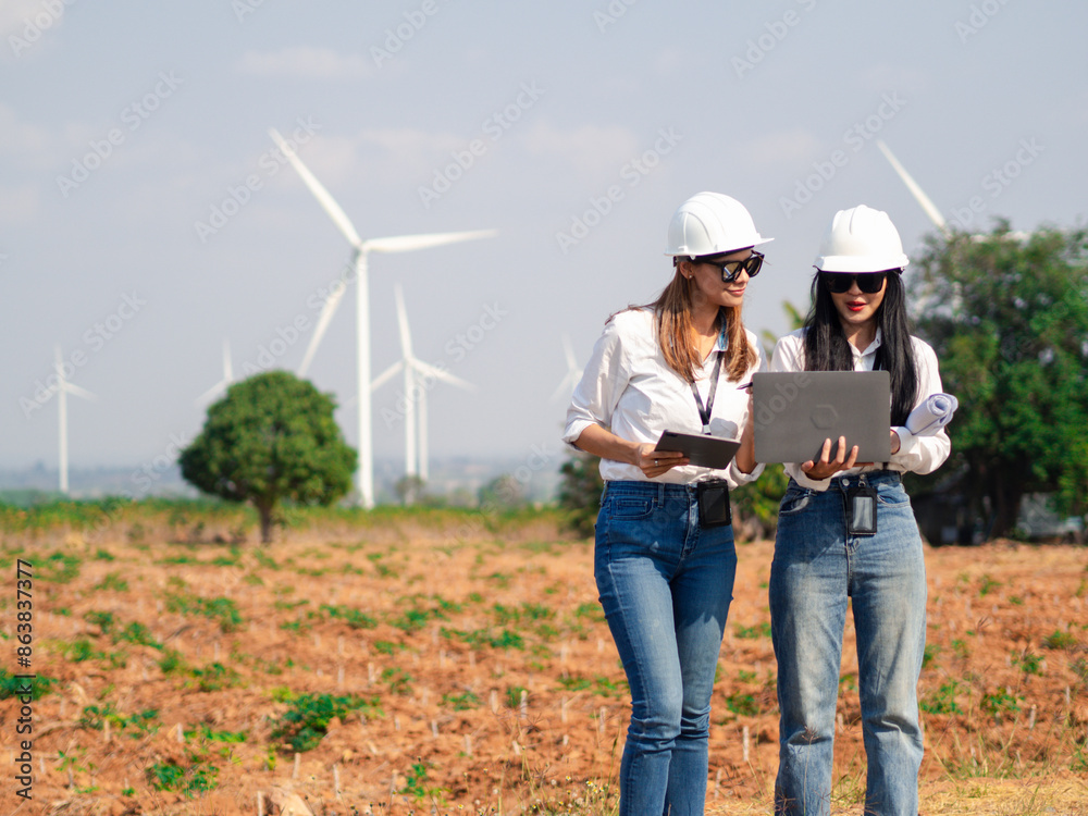 Group of architects working on the basis of a wind turbine Check area structure and wind turbines Group of architects working on the basis of a wind turbine Check area structure and wind turbines