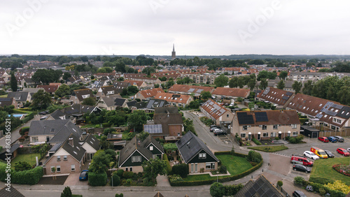 Aerial shot of houses with solar panels on roof in a street in a residential area neighborhood in Steenwijk, Overijssel, The Netherlands. photo