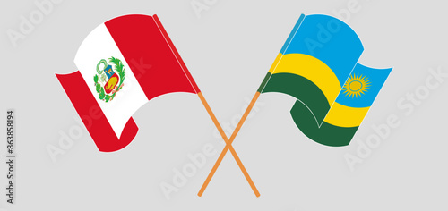 Crossed and waving flags of Peru and Rwanda