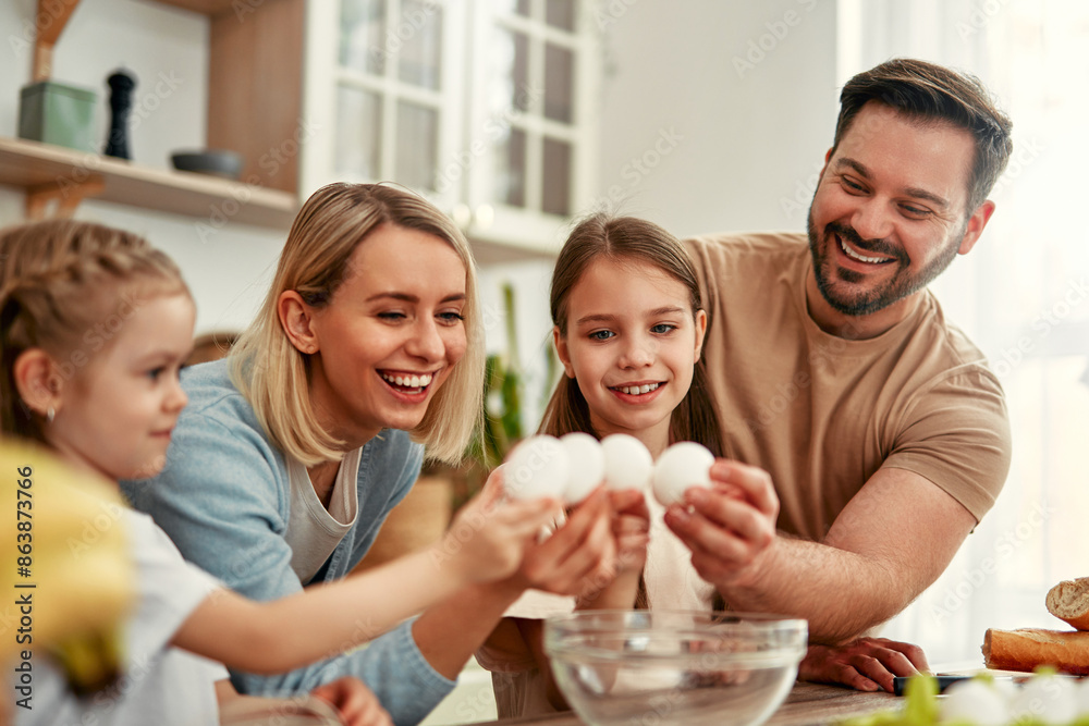 Happy Family Cooking Together in the Kitchen with Children, Laughing, and Bonding Happy Family Cooking Together in the Kitchen with Children, Laughing, and Bonding