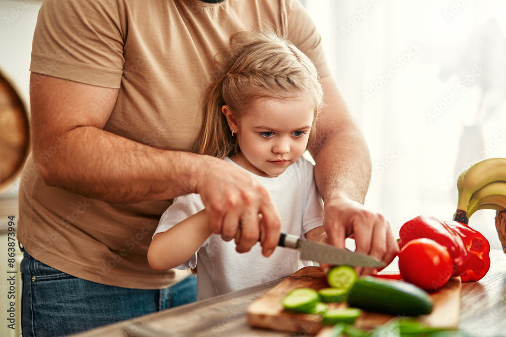 Happy Family Cooking in Kitchen: Father and Children Prepping Vegetables and Baking Happy Family Cooking in Kitchen: Father and Children Prepping Vegetables and Baking