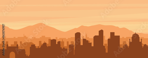 Brown panoramic poster of the city skyline with misty background buildings, sunrise, clouds and mountains of MUMBAI, INDIA