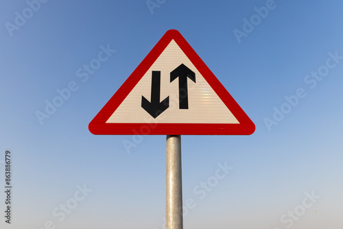road sign front on directing two way