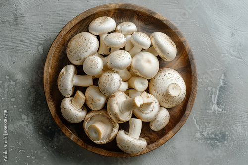 White Freddy mushrooms on wooden bowl photo