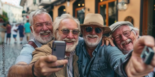 A group of older men posing for a photo in front of a blurred background photo