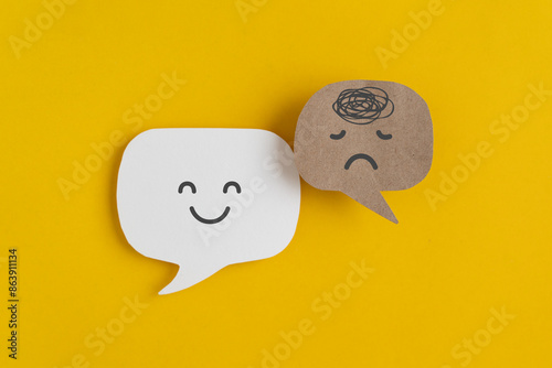 Mental health, brain disorder concept. World mental health day, Alzheimer and Psychology concept. Tangle of thoughts and happy face on real speech bubble with yellow background