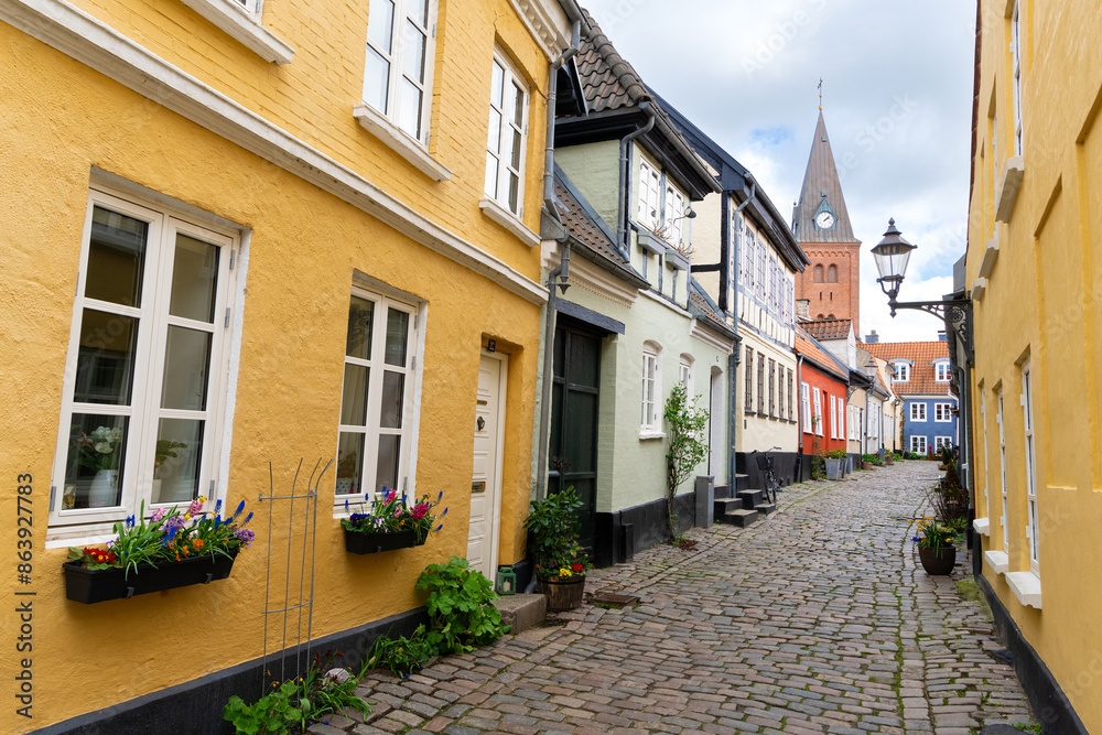 Fototapeta premium Hjelmerstald street in Aalborg, Denmark. Church of Our Lady in the back