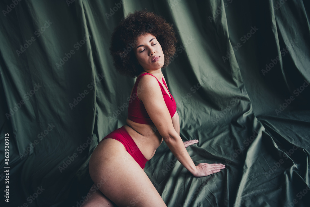 Naklejka premium Photo portrait of lovely young lady sexy posing dressed red lingerie green studio background no filter self acceptance all body perfect