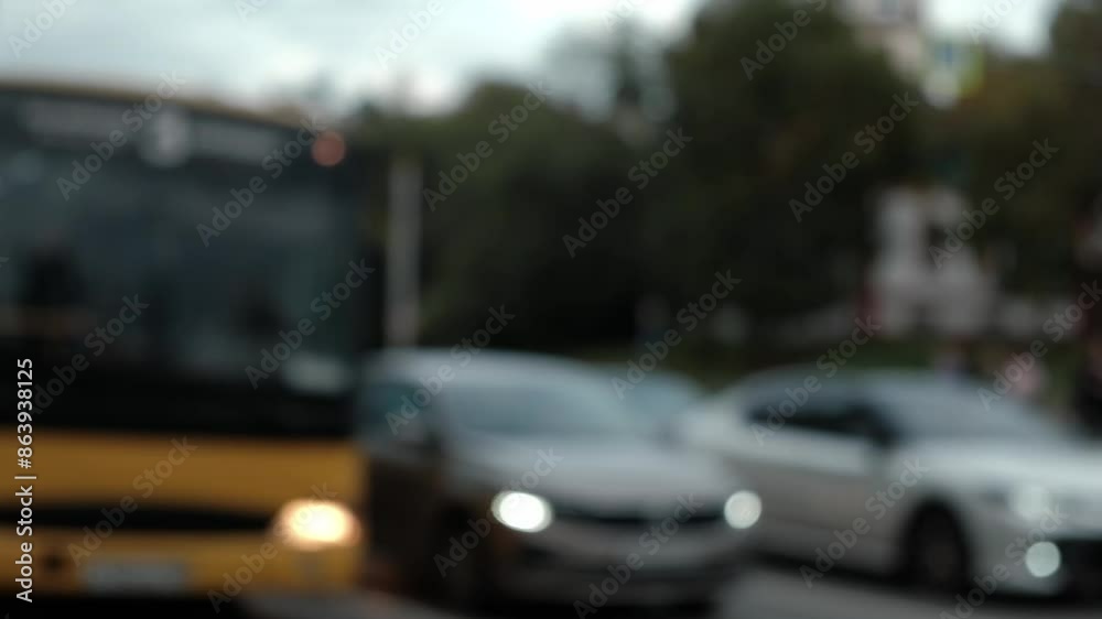 close-up of blurred passenger buses and minibuses moving slowly along city highway during rush hour. public transport on roads of city. slow motion. close-up of blurred passenger buses and minibuses moving slowly along city highway during rush hour. public transport on roads of city. slow motion.