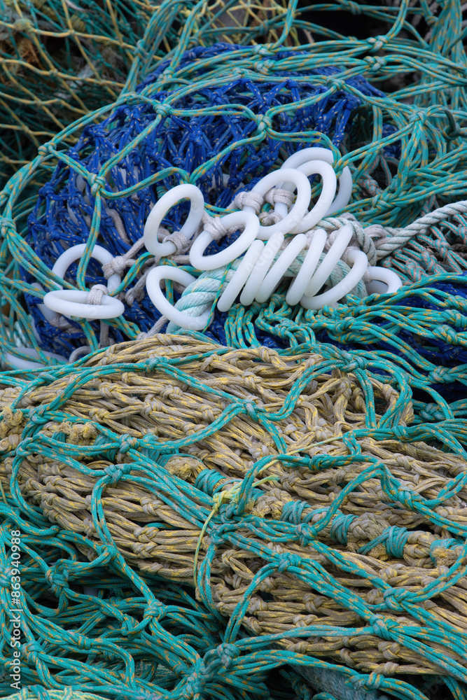 Nylon fishing nets in different colours and states of repair Nylon fishing nets in different colours and states of repair