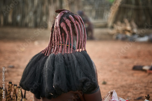 Headdress with braids of a Himba woman photo