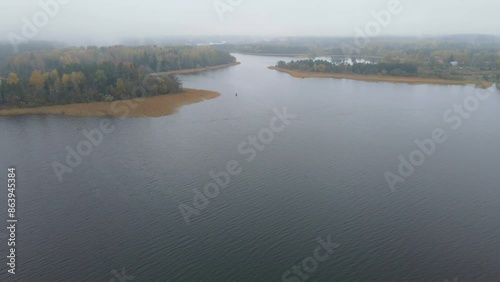 Top view of Lake Seliger in the morning fog at dawn. Autumn aerial landscape. High quality 4k footage