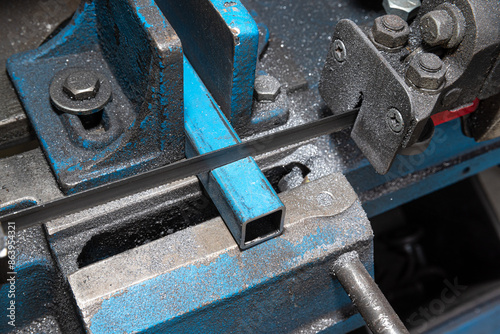 Metal cutting Horizontal Band Saw, part way through cut. Metal saw.
