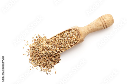 Top view of a wooden scoop filled with Organic Chicory or Kasni (Cichorium intybus) seeds. Isolated on a white background. photo