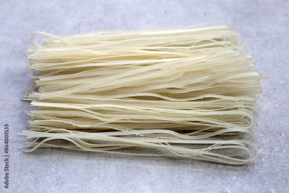 Dried uncooked rice noodles. Raw rice flour noodles Dried uncooked rice noodles. Raw rice flour noodles
