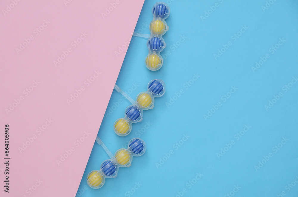 Toilet rim block cleaners on blue pink background. Top view Toilet rim block cleaners on blue pink background. Top view