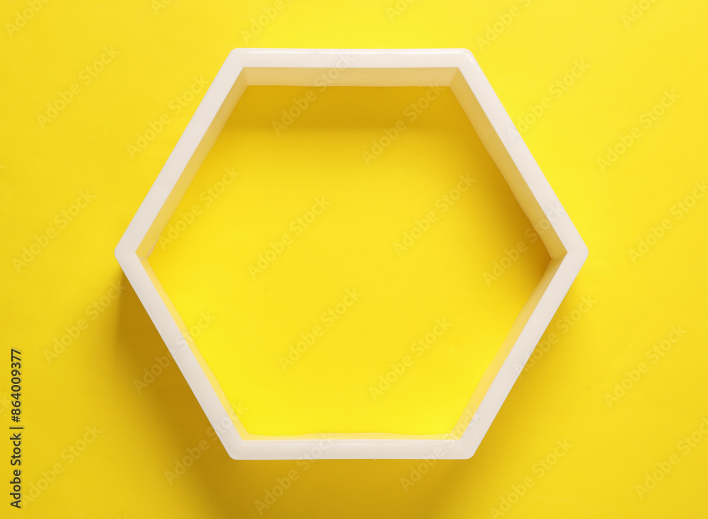 Honeycomb shelf on a yellow background Honeycomb shelf on a yellow background