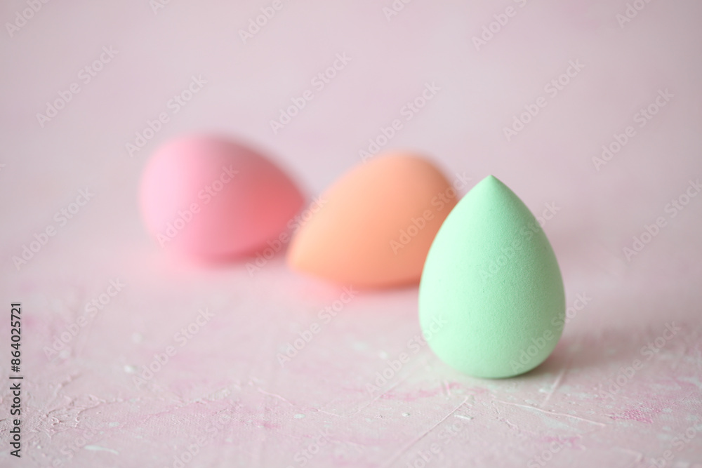 Makeup egg sponges on a pink background Makeup egg sponges on a pink background