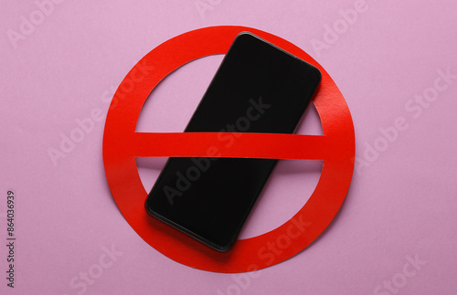 Bild auf Leinwand Smartphone with red prohibition sign on pink background. Ban.