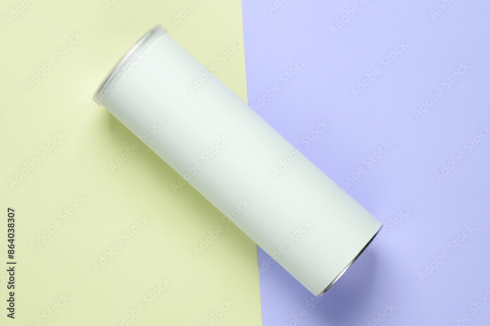 Tin empty tube of chips with a white blank label for your design on pastel background. Top view Tin empty tube of chips with a white blank label for your design on pastel background. Top view