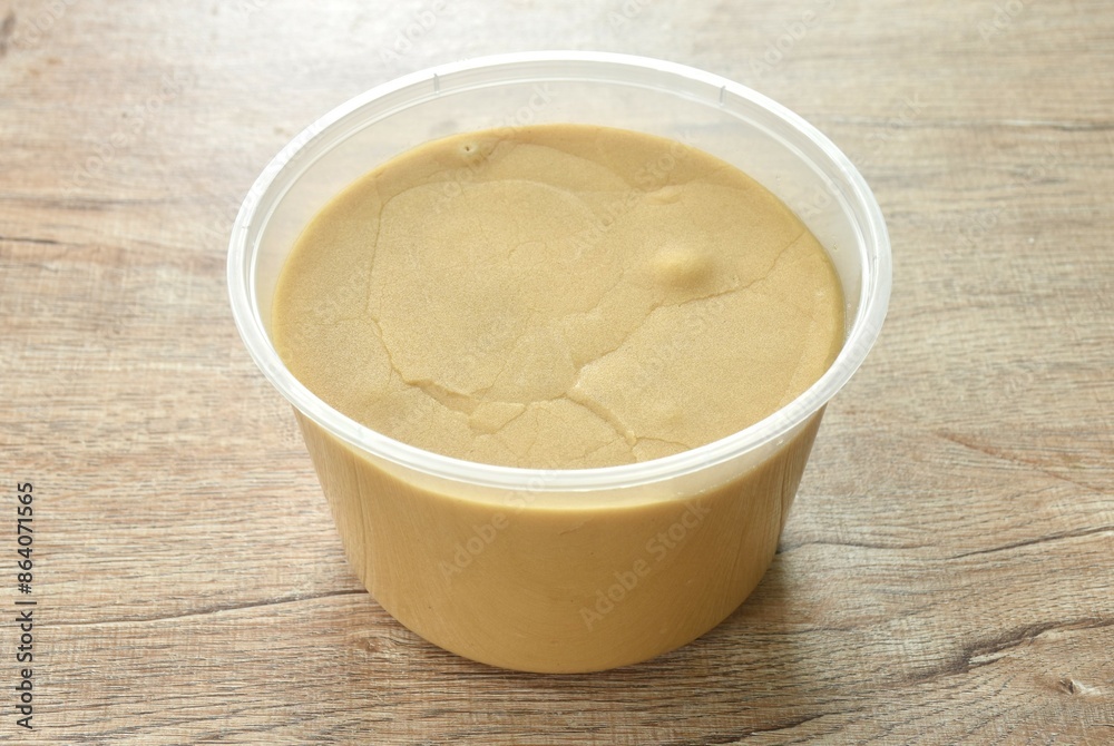 palm sugar in circle transparent plastic box packaging on table palm sugar in circle transparent plastic box packaging on table