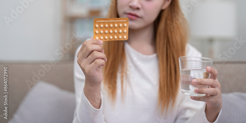 Woman Holding Birth Control Pills and Glass of Water, Contraceptive Medication, Family Planning, Healthcare Concept