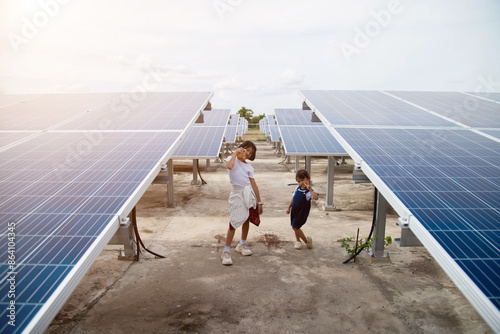 Children playing near solar panels