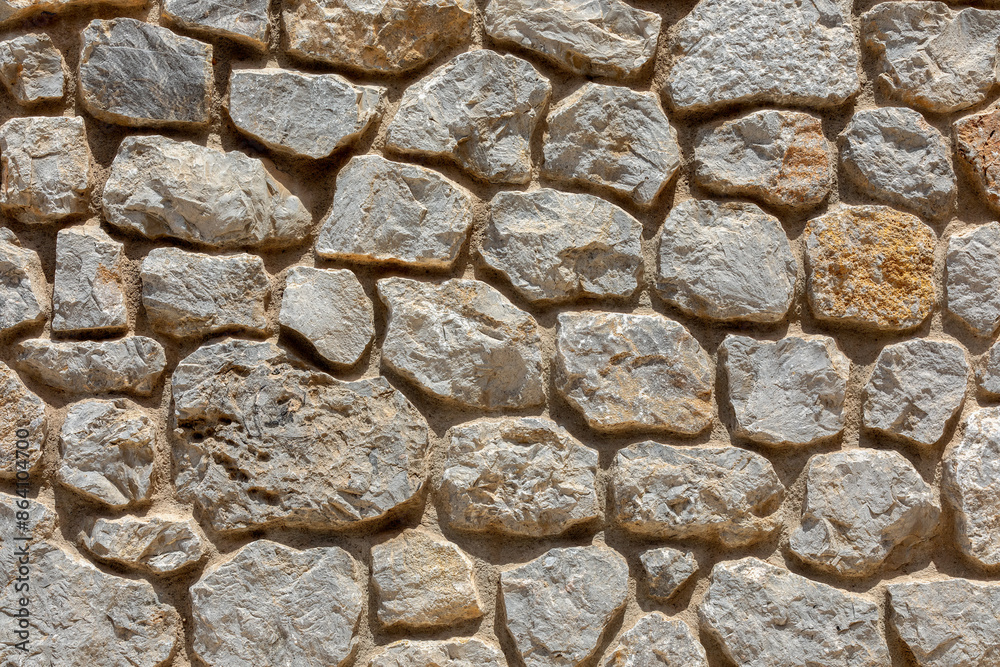 Gray Stone Wall Background Texture - Rugged and Rustic Masonry Surface Gray Stone Wall Background Texture - Rugged and Rustic Masonry Surface