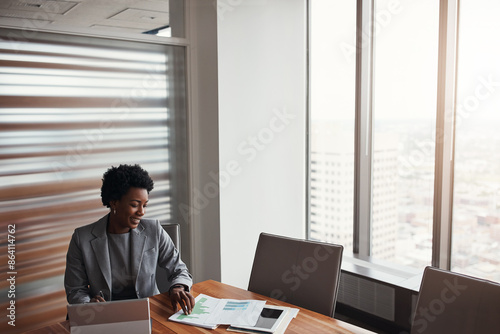 Black woman, paperwork and finance in office, research and plan for growth on laptop. Female person, banker and review credit report or loan application at insurance agency, performance and stats © peopleimages.com