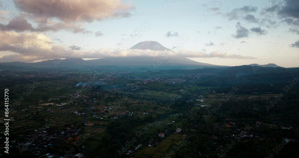 Moody tranquil skies, Volcanic mountain backdrop, Indonesian sunset, aerial Moody tranquil skies, Volcanic mountain backdrop, Indonesian sunset, aerial