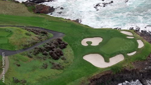 Pebble Beach golf course in Monterey over the Pacific Beach Peninsula, aerial orbit view photo