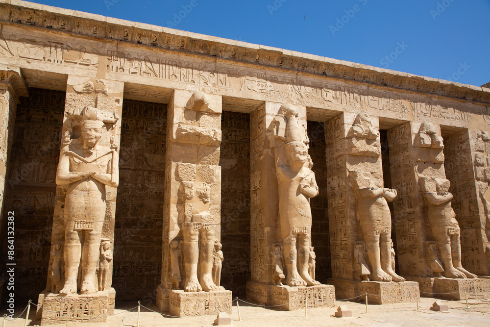 Osirian Statues, Northern Portico, First Courtyard, Medinet Habu, Mortuary Temple of Ramesses III, 1187-56 BCE, Ancient Thebes, UNESCO World Heritage Site, Luxor, Egypt, North Africa, Africa Osirian Statues, Northern Portico, First Courtyard, Medinet Habu, Mortuary Temple of Ramesses III, 1187-56 BCE, Ancient Thebes, UNESCO World Heritage Site, Luxor, Egypt, North Africa, Africa