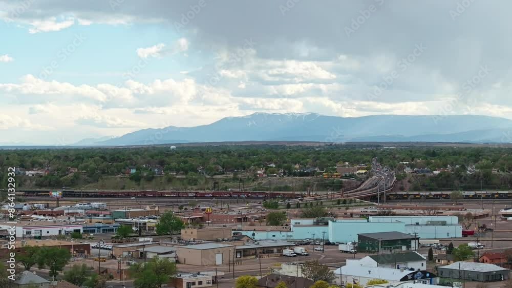 Panoramic aerial overview of highway on ramp and train yard in Pueblo Colorado Panoramic aerial overview of highway on ramp and train yard in Pueblo Colorado
